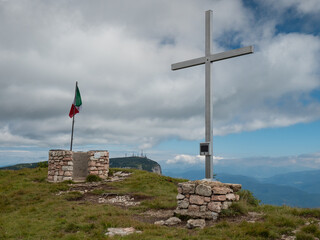Iron cross at Canfedin mountain top in alp, Andalo and Molveno region - 653587555