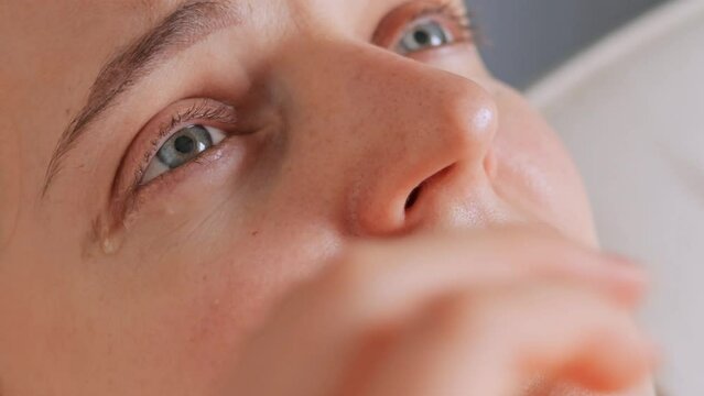 Closeup of crying woman with tears feeling sadness and sorrow having troubles being in deep depression life difficulties, stress and emotional problems.