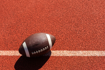 American football on court of gymnasium sport floor