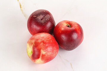 Ripe sweet juicy nectarines heap
