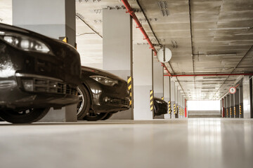 Selective focus, blurred background. Parking place. Safety parking with cars