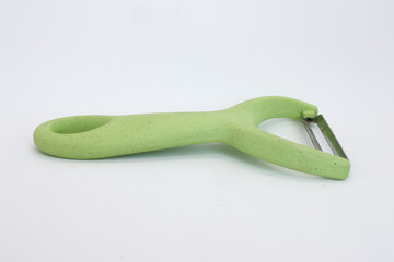 kitchen tools scissors, knife, and fruit peeler isolated on white