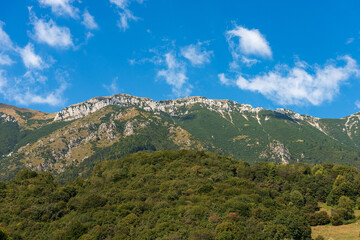 Baldo Mountain (Monte Baldo) in summer, east side, seen from the small village of Ferrara di Monte Baldo, Verona province. Mountain range between Lake Garda and Adige Valley, Italian Alps. Italy.