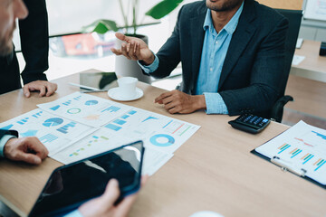 Asian business advisor meeting to analyze and discuss the situation on the financial report in the meeting room.Investment Consultant, Financial , teamwork ,brainstorming ,startup and accounting