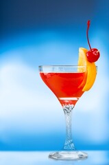 Glass of tasty alcohol cocktail on the desk