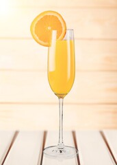Glass of tasty alcohol cocktail on the desk