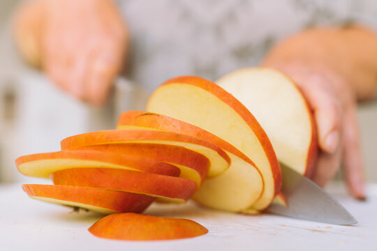 Slicing apples into slices - Powered by Adobe