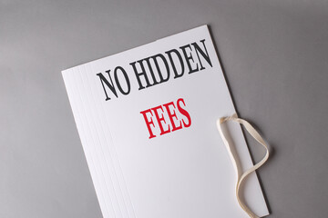 NO HIDDEN FEES text on white folder on grey background