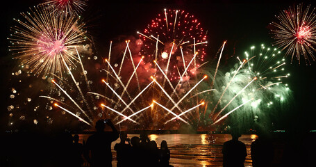 Green Firework celebrate anniversary happy new year 2024, 4th of july holiday festival. Green firework in night time celebrate national holiday. Countdown to new year 2024 festival party time event