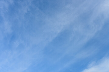 Blue sky and tiny white clouds for background.