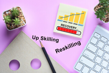 Business recovery loading with economic growth graph on sticky note and keyboard on desk. Year 2023...