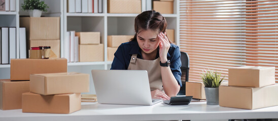SME business entrepreneurs who conduct online sales businesses Sitting stressed while checking...