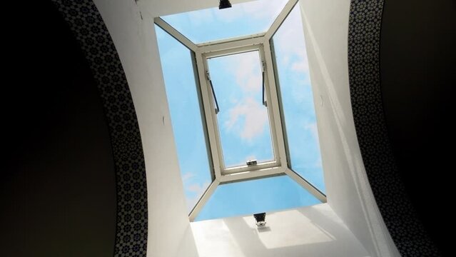 Skylight Window with Operable Vent and Blue Sky Background