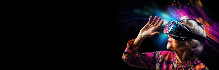  senior woman wearing virtual reality headset neon pink and blue colors horizontal website banner copy space left. Grandma in VR glasses. Augmented reality universe and futurist technology concept. © Dina