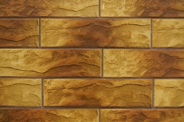 Closeup of brick like brown embossed ceramic tiles siding
