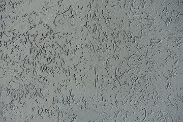 Texture of gray wall with stucco worm swirl finish