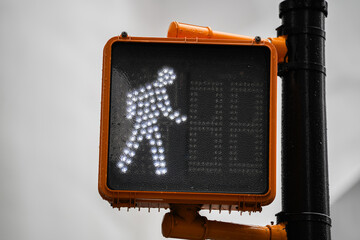 White pedestrian traffic light showing that you are allowed to cross the street. Pedestrian traffic signs industry. - obrazy, fototapety, plakaty