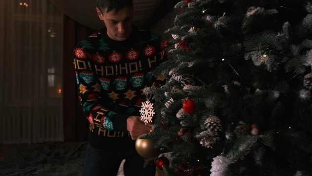 parents and dani decorate the Christmas tree together, family on New Year's Eve, family having fun on New Year's Eve, family holiday, New Year's holidays, New Year's Eve