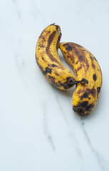black rotten bananas, rotten bananas on a white background. unhealthy concept.