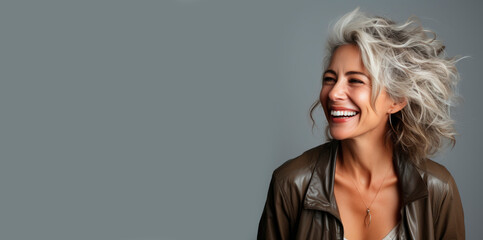 Portrait of a beautiful smiling elderly woman with gray hair