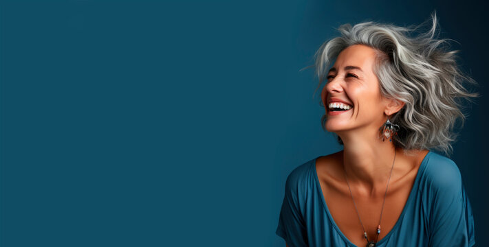 Portrait of a beautiful smiling elderly woman with gray hair