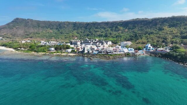 Aerial view from afar to near of the Taiwan Strait seaside town of Pingtung, Taiwan.