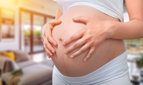pregnant woman naked belly hold in hands, AI generated image