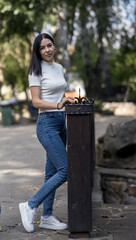 Young woman in the park in casual clothes