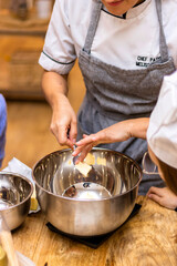 Christmas cookies workshop. Pastry chef prepares the butter.