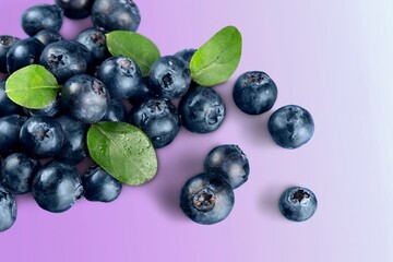 Tasty fresh ripe blueberries on the desk