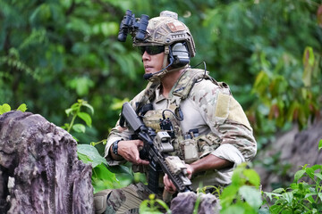 Military army soldiers tactical team, commando group moving cautiously in forest area, kneeling and...