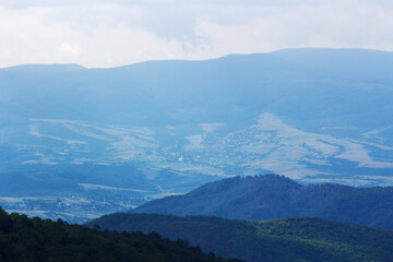 Fototapeta premium mountainous rolling landscape in summer. nature background in morning light