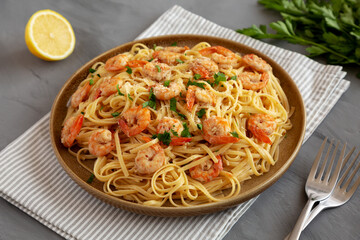 Baked Shrimp Scampi Linguine Pasta with Parsley on a Plate, side view.