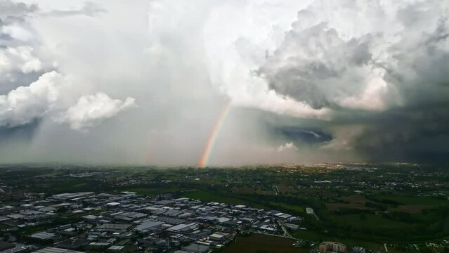 Italian roads under stormy drama with a rainbow.
