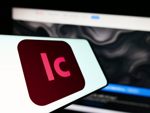 Stuttgart, Germany - 09-24-2023: Smartphone with logo of word processing software Adobe InCopy on screen in front of business website. Focus on center of phone display.