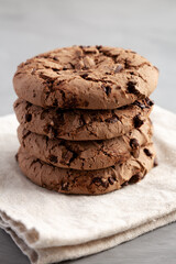 Stack of Fresh Dark Chocolate Chip Cookies, side view. Close-up.
