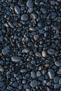 small rocks covered in Reynisfjara Beach