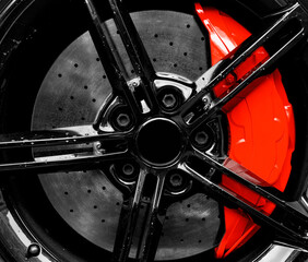 Car alloy wheel and tyre texture background. New alloy wheel with tire and red carbon ceramic brakes. Alloy rim isolated. Car wheel disc. Car spare parts.