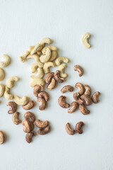 Roasted and cleaned cashew nuts placed on the white background and shot from above angle. Famous Goan cashew or Caju sample.