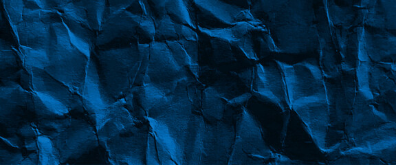 Blue crumpled paper texture background, grunge black and blue crumpled paper texture.

