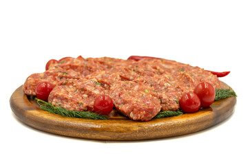 Meatballs isolated on white background. Raw beef meatballs with herbs and spices