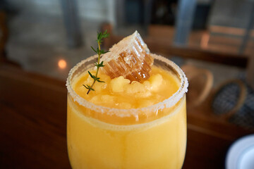 Honeycomb and herb adorned refreshing mango smoothie