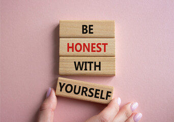 Be honest with Yourself symbol. Wooden blocks with words Be honest with Yourself. Businessman hand. Beautiful pink background. Be honest with Yourself concept. Copy space.