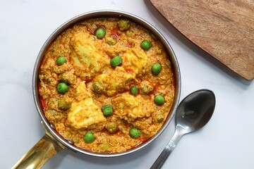 Famous Indian curry dish Paneer matar masala. vegetarian North Indian dish consisting of peas and paneer in a tomato based sauce, spiced with indian spices and garam masala. peas and cottage cheese. 