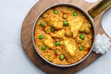 Famous Indian curry dish Paneer matar masala. vegetarian North Indian dish consisting of peas and paneer in a tomato based sauce, spiced with indian spices and garam masala. peas and cottage cheese. 