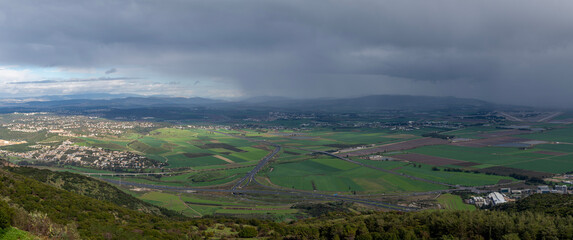 Panoramic view of the Jezreel Valley from the Carmel Mountain at Muhraqa viewpoint.

