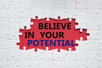 Potential symbol. Concept word Believe in your Potential on white puzzle. Beautiful red background. Business and Believe in your Potential concept. Copy space