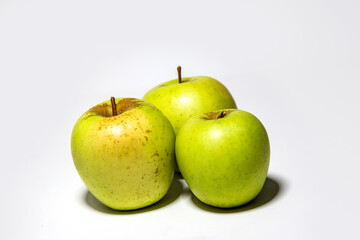 green yellow apples on a white background