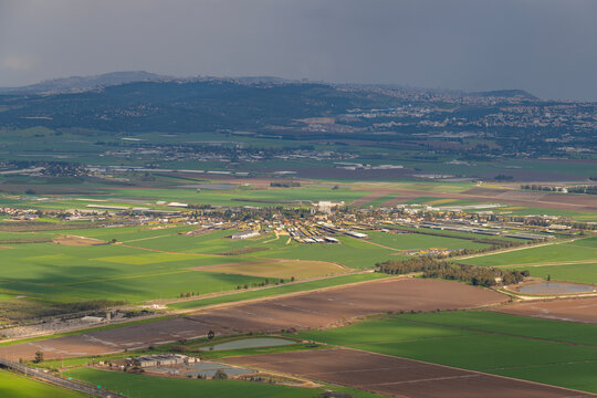 View of Kfar Yehoshua from Muhraqa viewpoint on Mount Carmel in Israel. Kfar Yehoshua is a moshav, farming community that is laid out in a circular shape.
