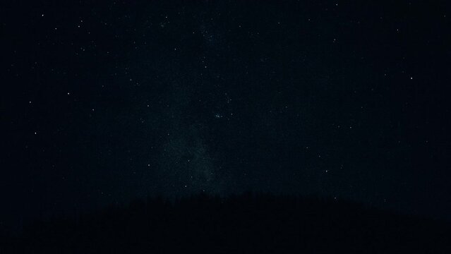 Perseids meteor shower shooting stars constellation. Night sky with falling stars in real time